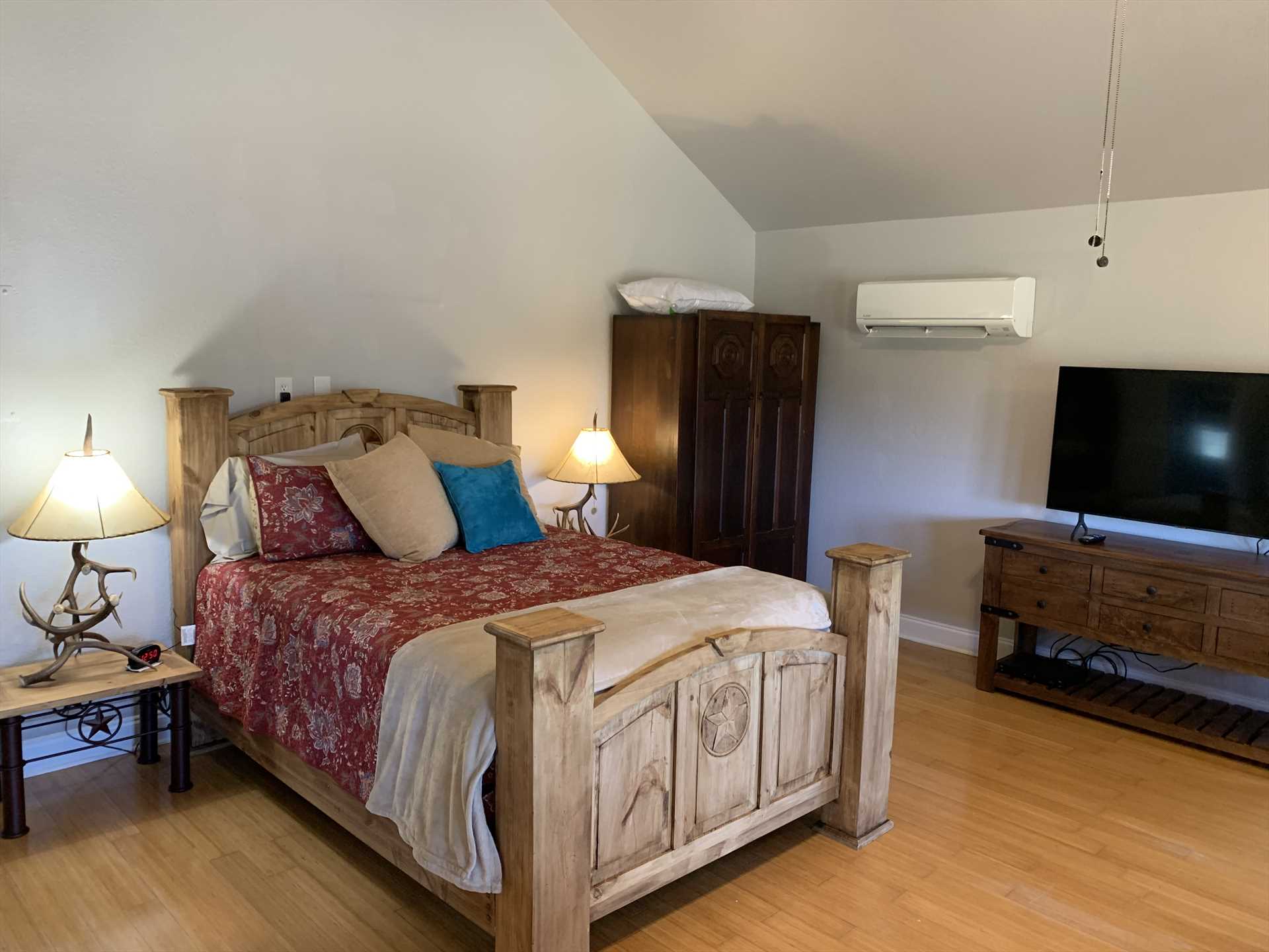                                                 The handsome woodwork at the head and foot of the big queen bed highlight where you'll enjoy restful sleep. Bed and bath linens are provided, too!