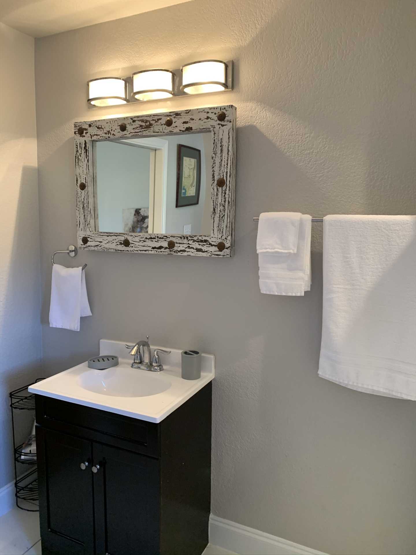                                                 Subtle but friendly decorative touches, like the ornate mirror in the bathroom, help make the Hideout a comfortable guest home for your intimate holiday.