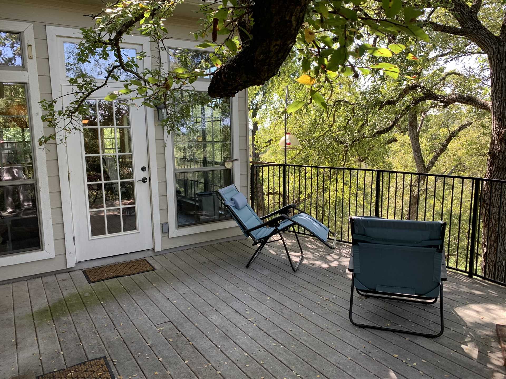                                                The tree-shaded patio is located up high, for stunning views! Kids and pets are protected on the patio by sturdy fencing. Please note that the path down to the river from here can be steep and occasionally slippery.