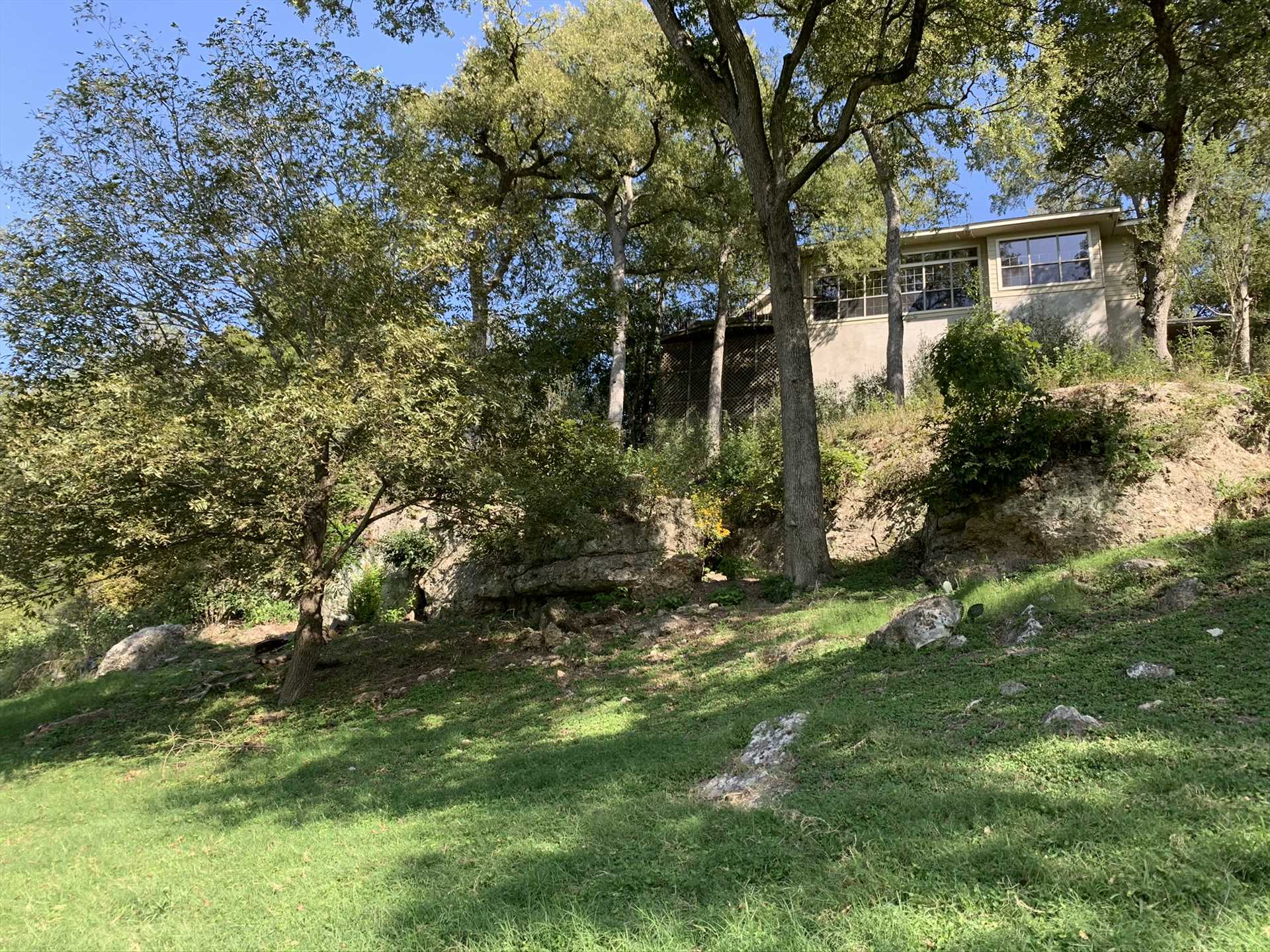                                                 This is the Retreat as seen from the banks of the Guadalupe. Now, reverse that, and imagine the river view you'll have from the top of the cliff!