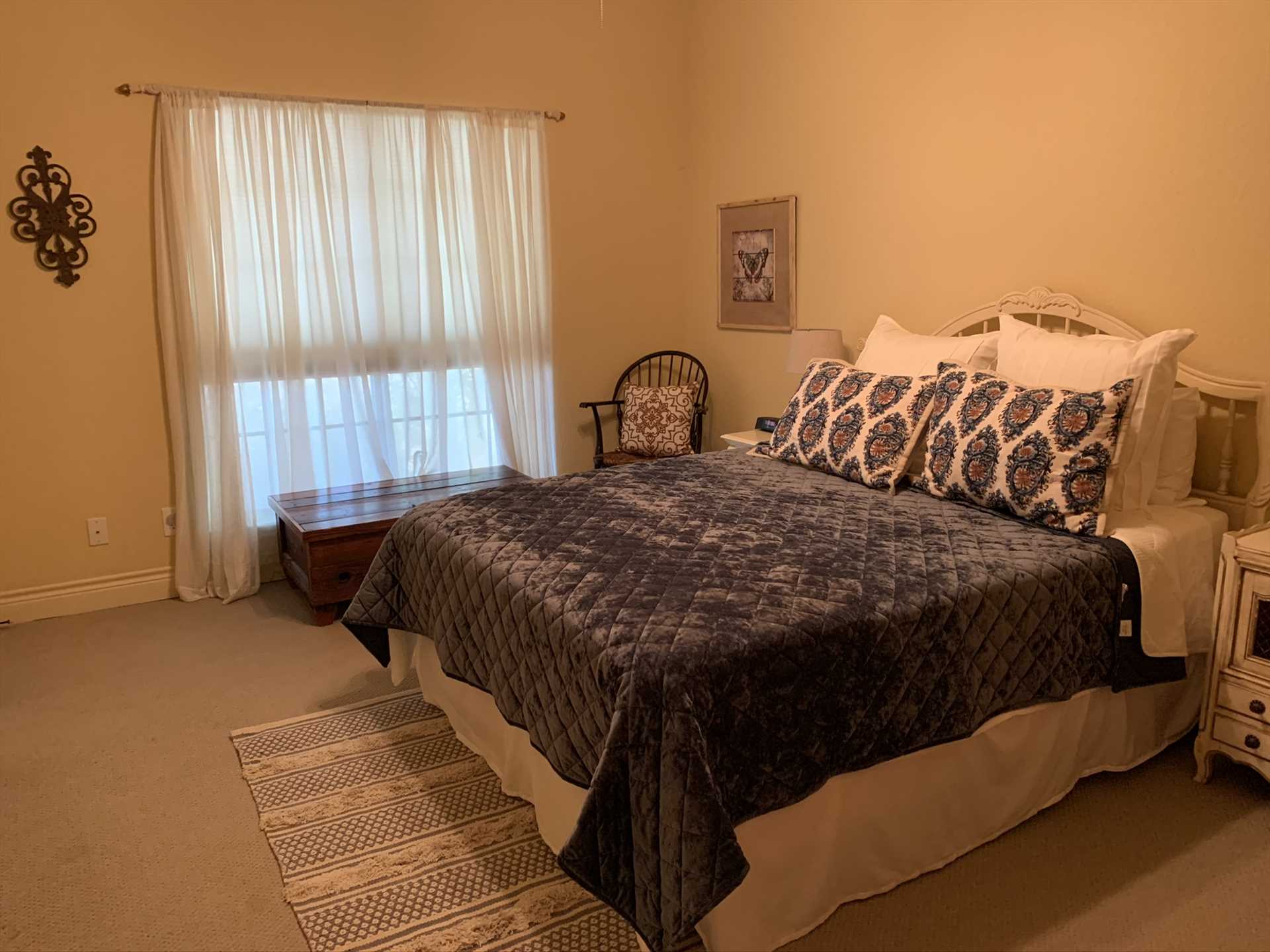                                                 A big queen-sized bed in the second bedroom is a comfy spot for peaceful slumber. As with all the beds in the Retreat, it's draped in clean, complimentary linens.