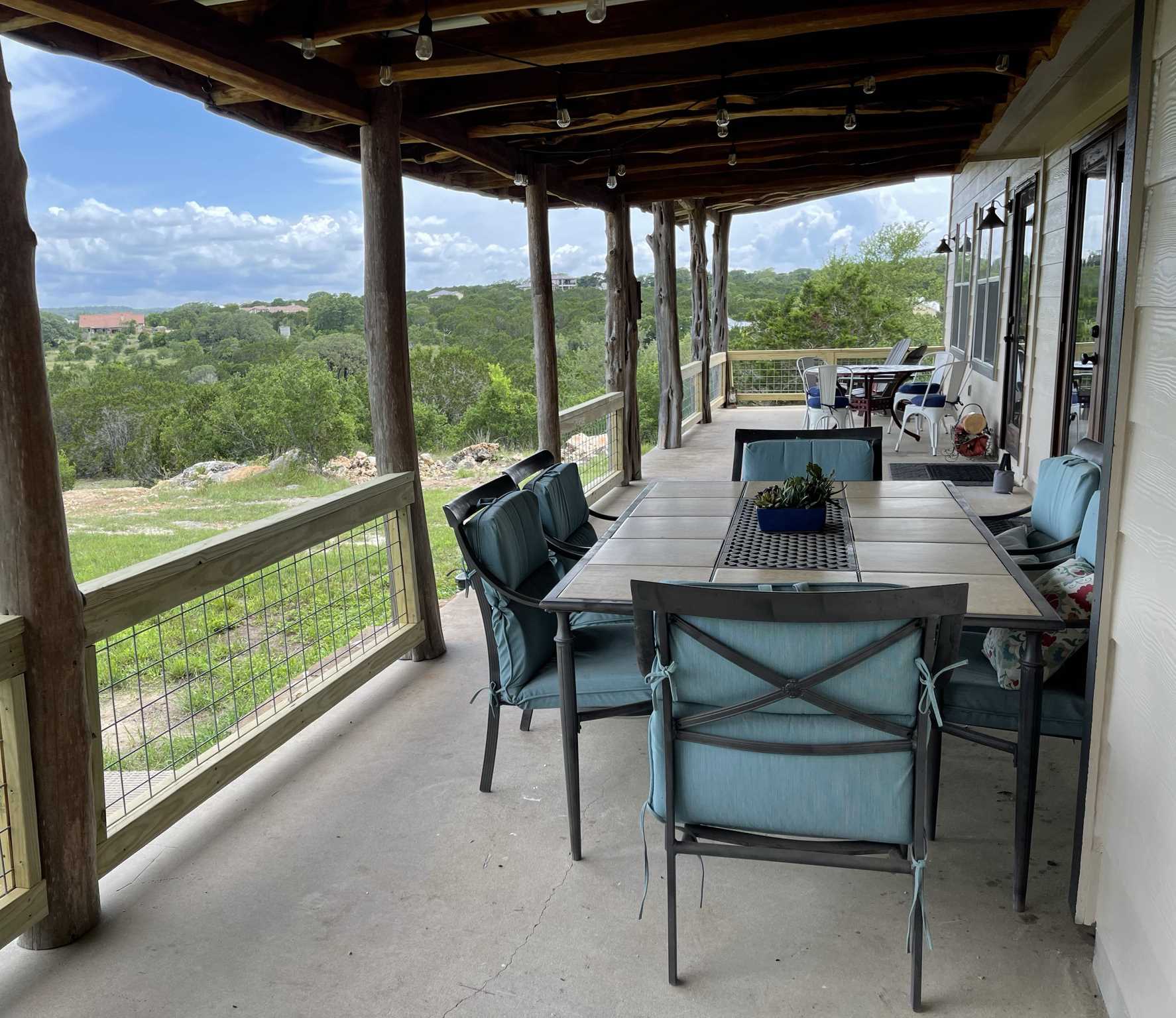                                                 Comfortable seating on the shaded patio gives you incredible Hill Country views from your mountain perch!