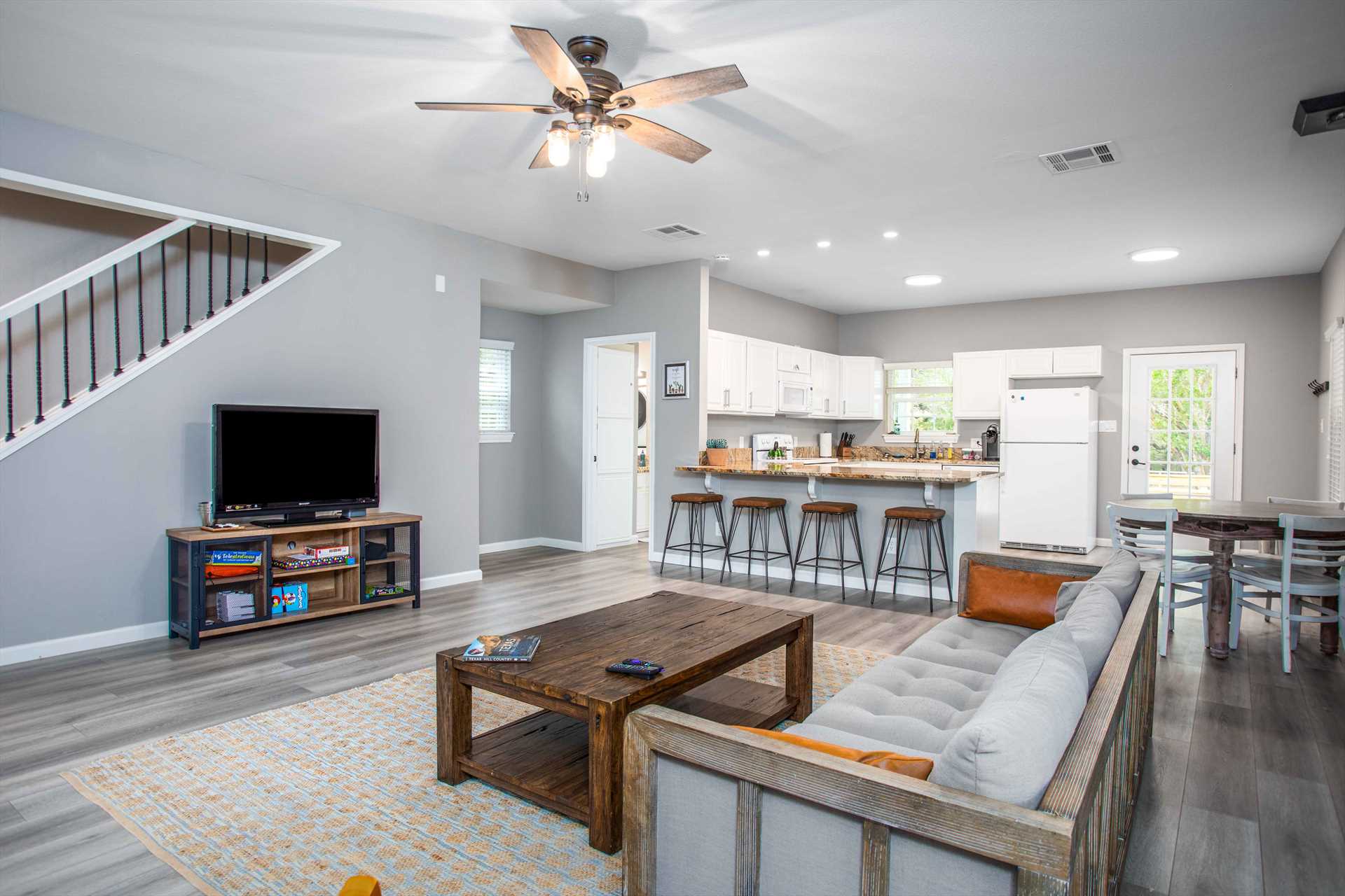                                                 No matter where you are on the main floor, you'll always be part of the fun and conversation, thanks to the bright and airy open-floor design here!