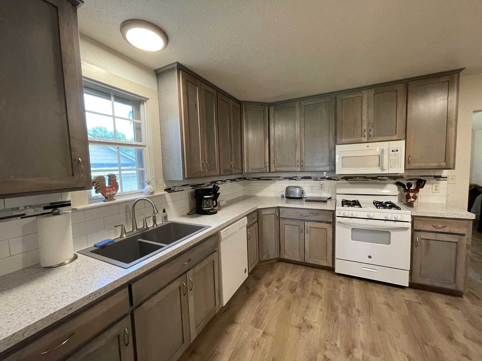                                                Our guests rave about the modern, clean, and roomy kitchen! It's got all the appliances, cooking ware, utensils, and serving ware you'll need for a great family feast.