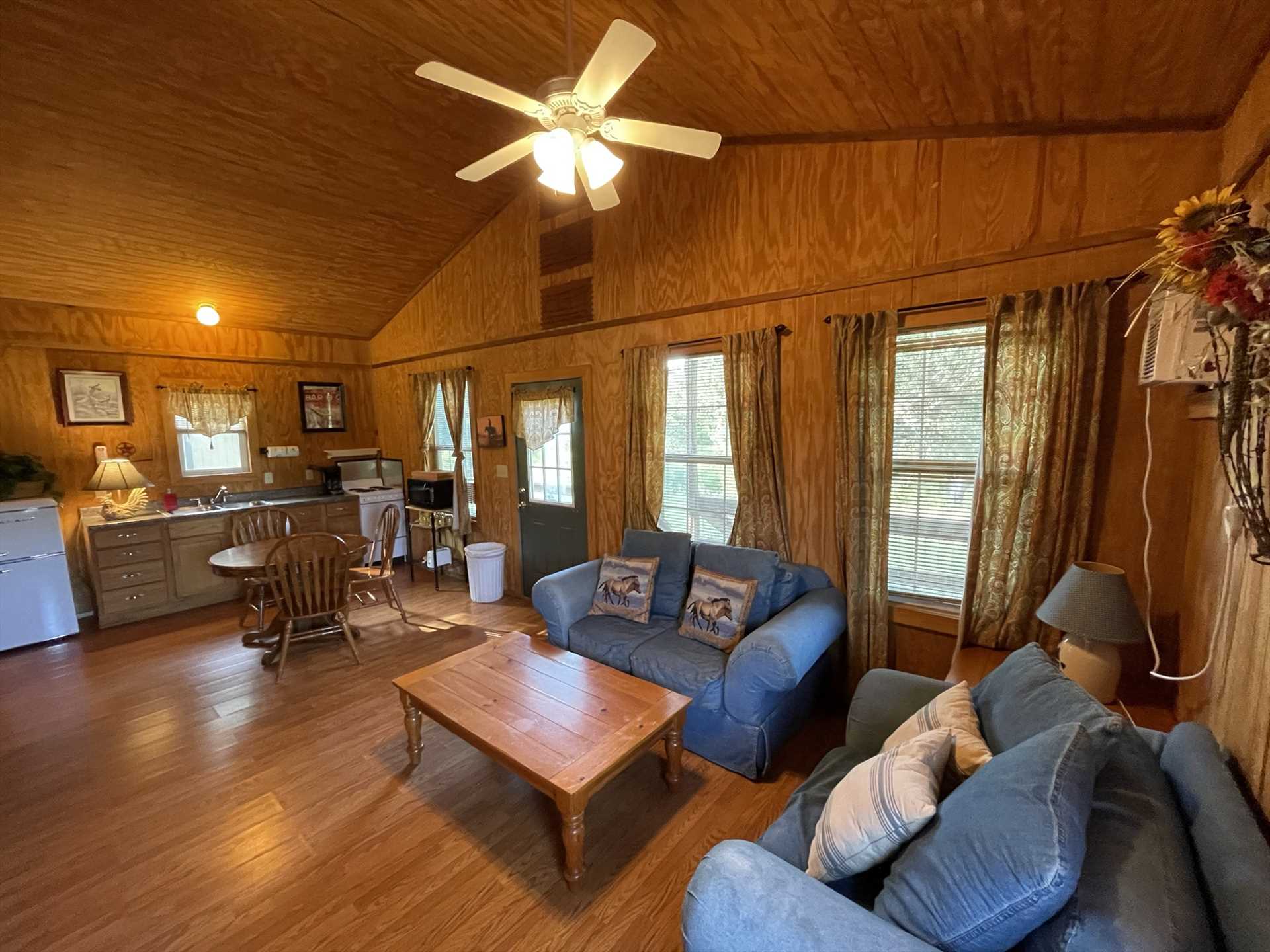                                                 Plenty of leg-stretchin' space greets your folks at the Lone Star Cabin, including a full kitchen, dining table, and warm and welcoming living area furniture!