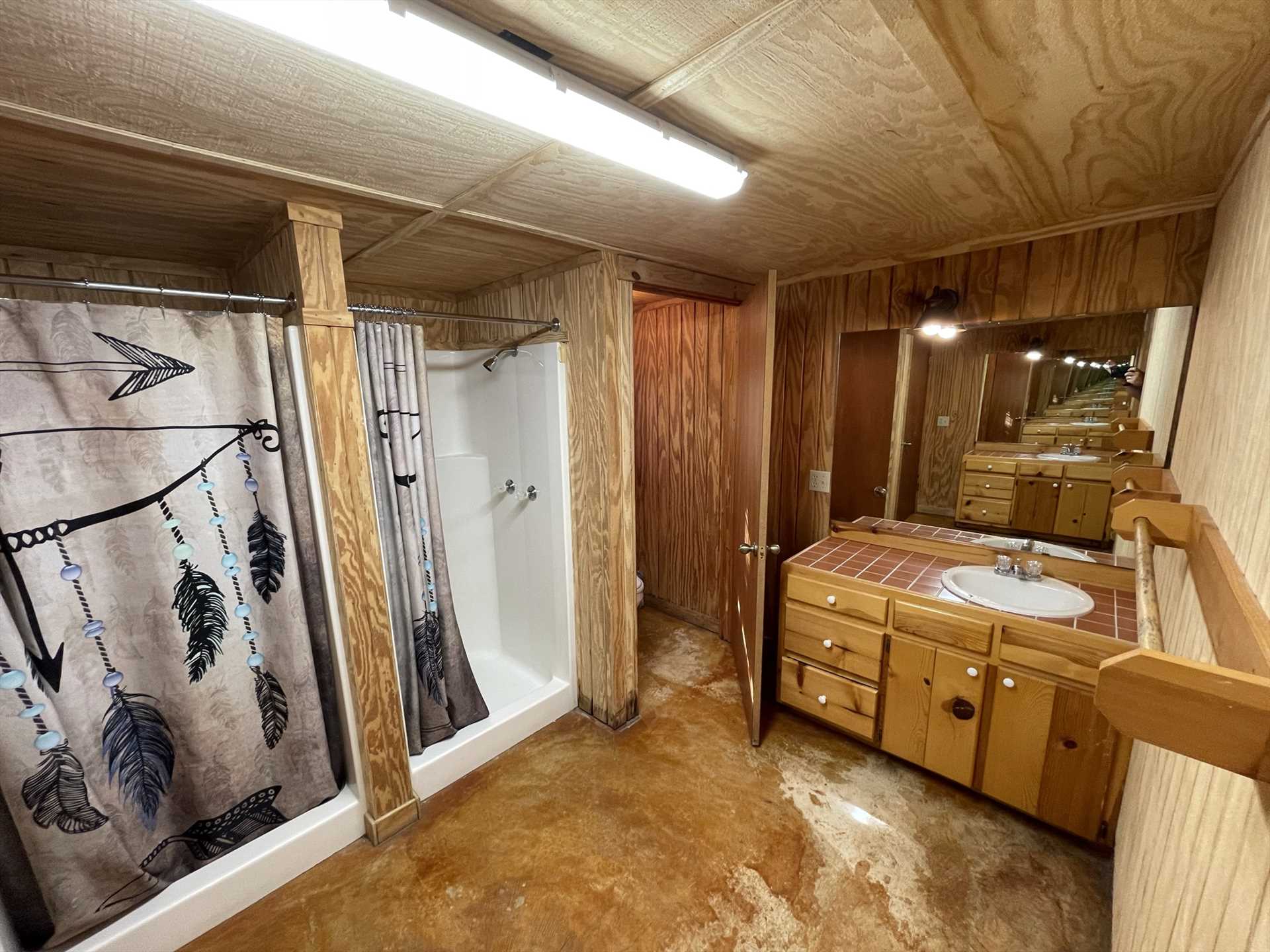                                                 Both bunkhouses feature fully functional baths, and each is equipped with two shower stalls.