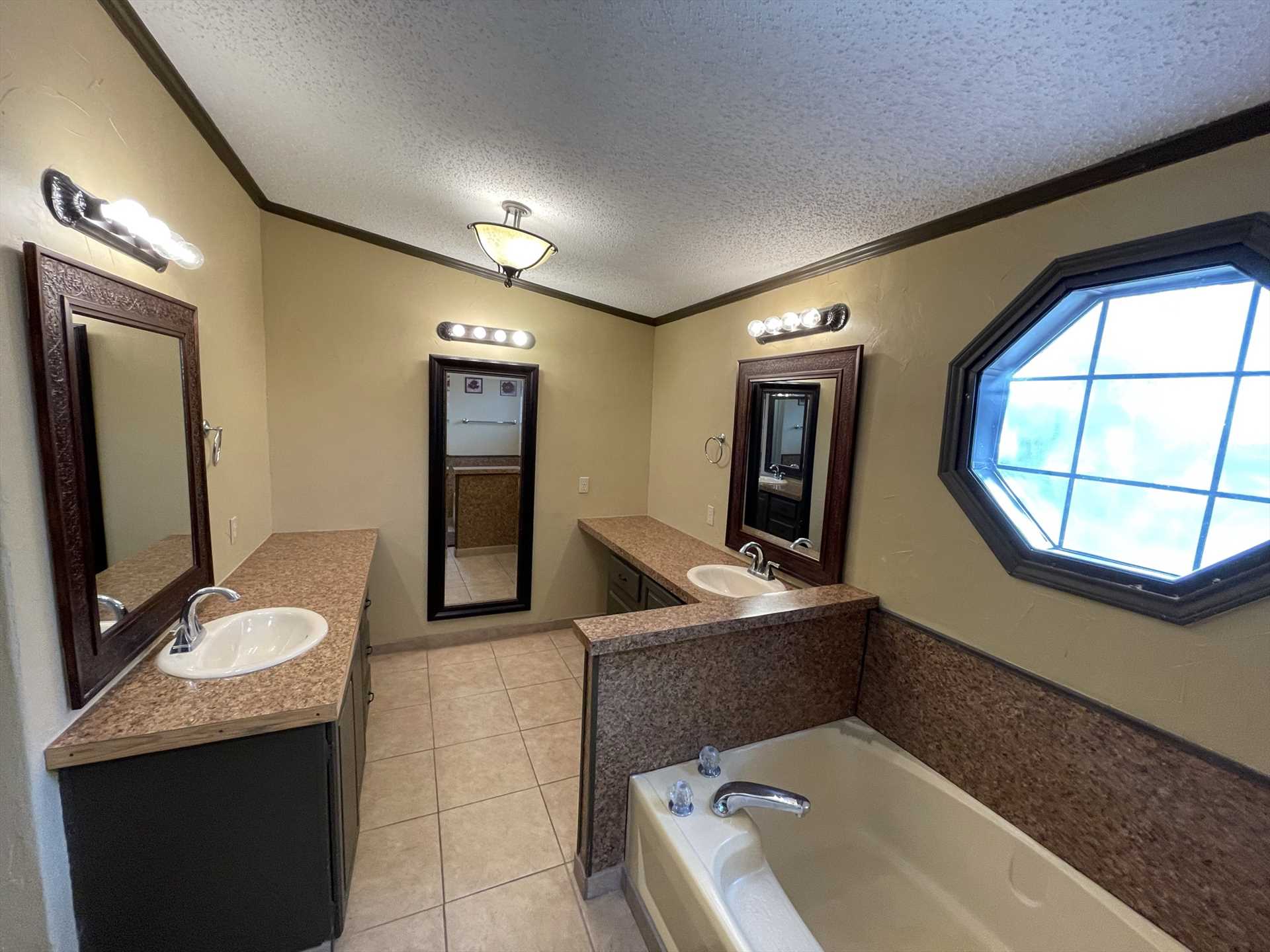                                                 Sharp and modern decor distinguishes the master bath of Rio Vista, which includes a roomy tub and separate shower.