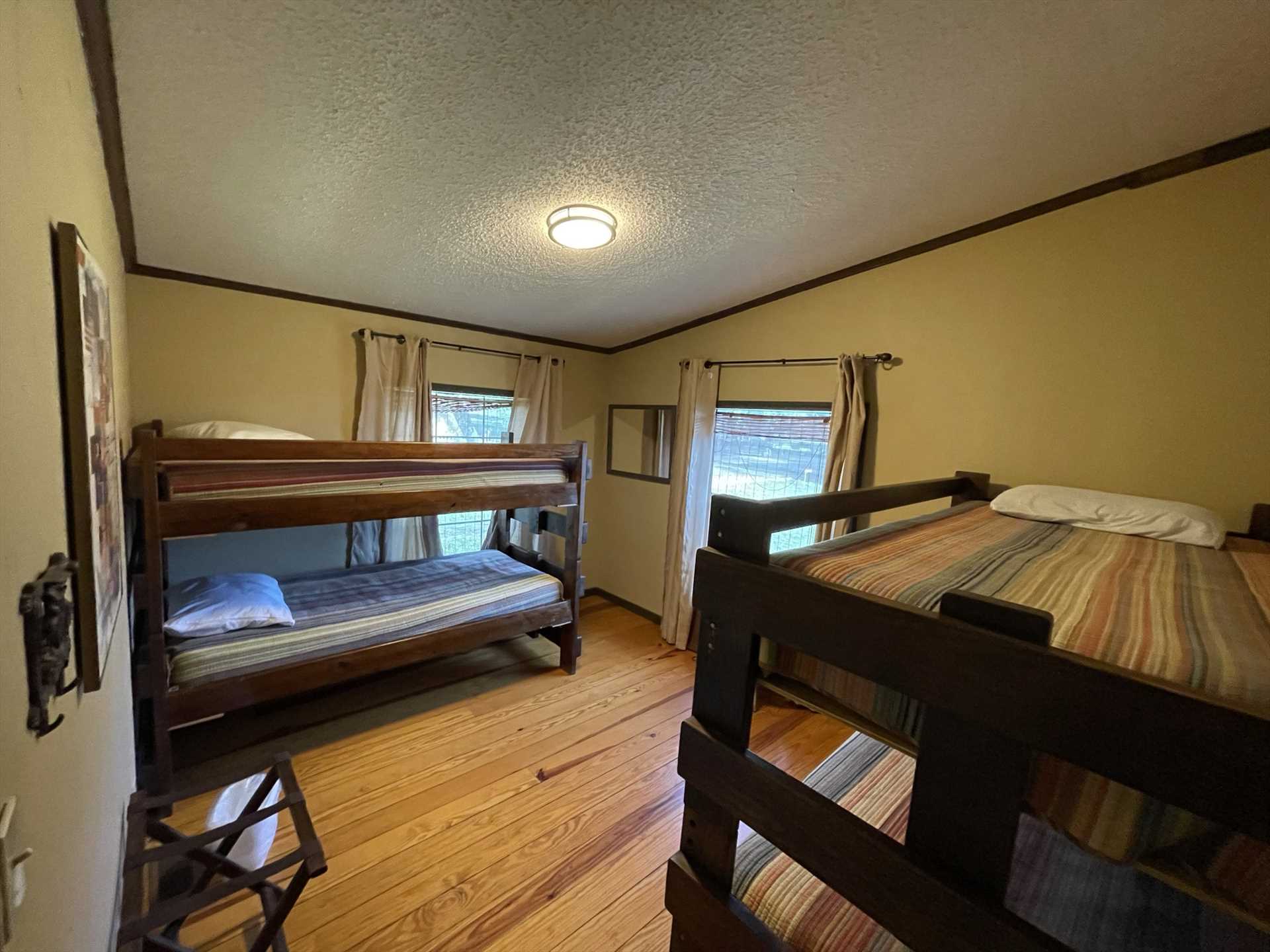                                                 Two sets of twin bunk beds can be found in the second bedroom at Rio Vista, offering comfortable sleeping accommodations for up to four in this guest home.