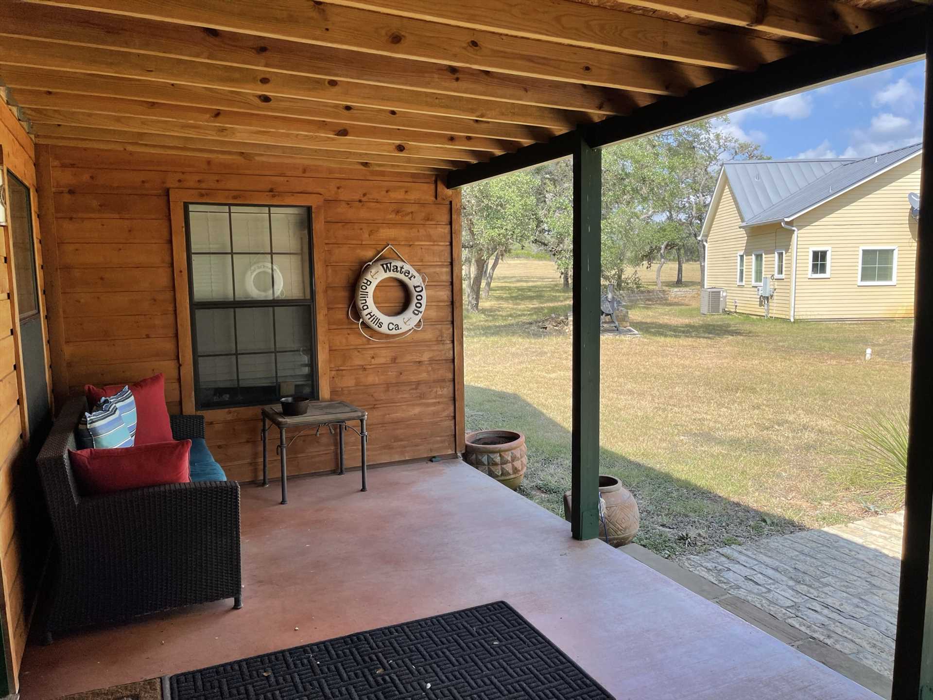                                                 We've created a comfy living space for you outside, with plush furniture on the shaded porch!