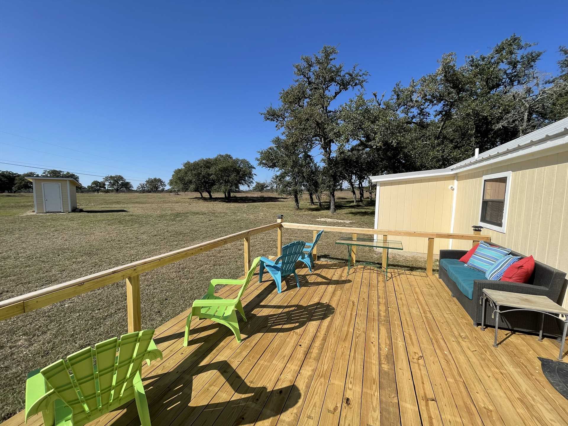                                                 Check out that view! Greet a new day, or wind down in the evening, on the roomy deck that faces the amazing beauty of the surrounding Hill Country.