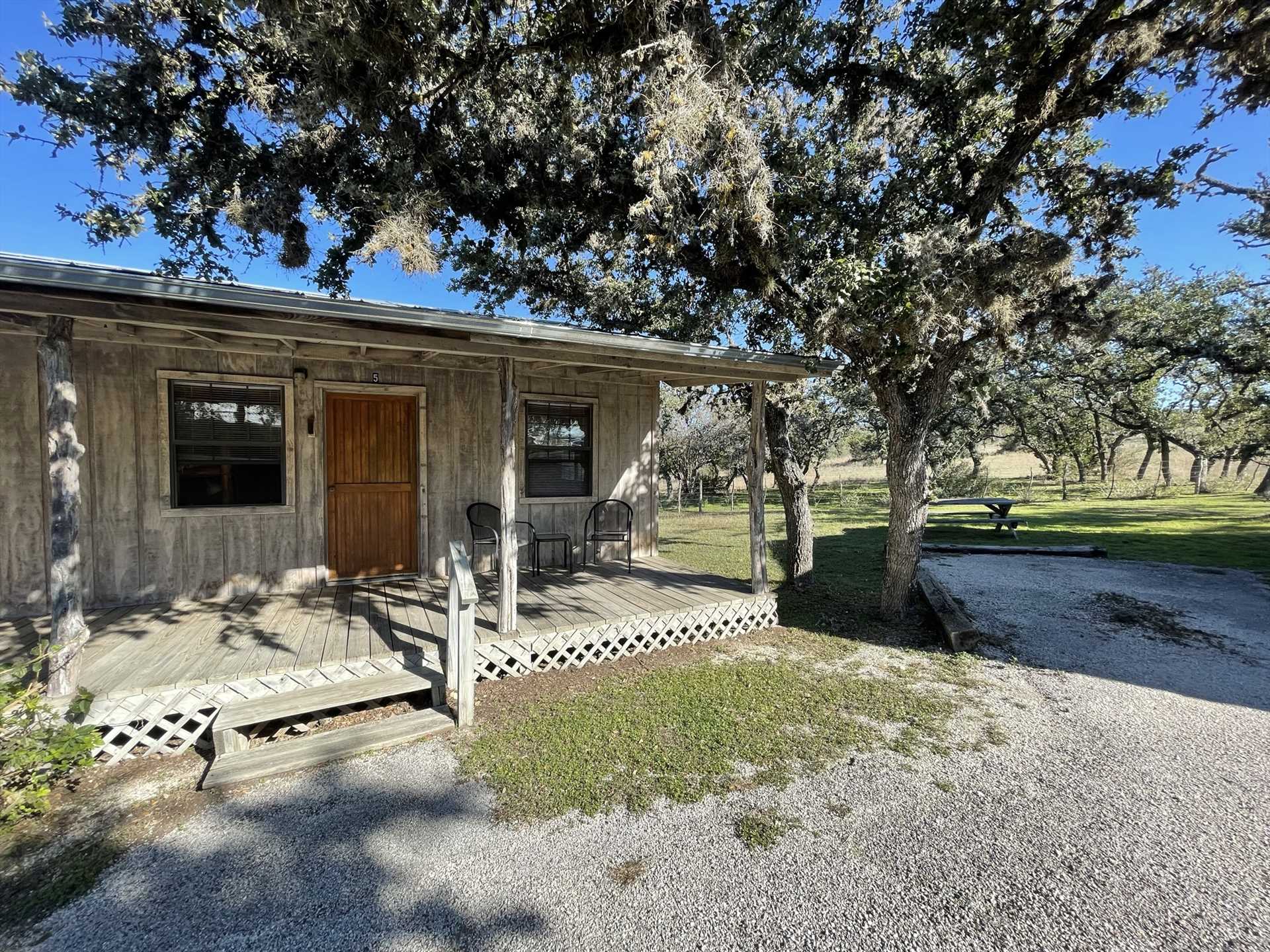                                                 Your peaceful and refreshing Hill Country getaway awaits you at the Red Oak Room #5 on the spacious and beautiful West 1077 Guest Ranch!