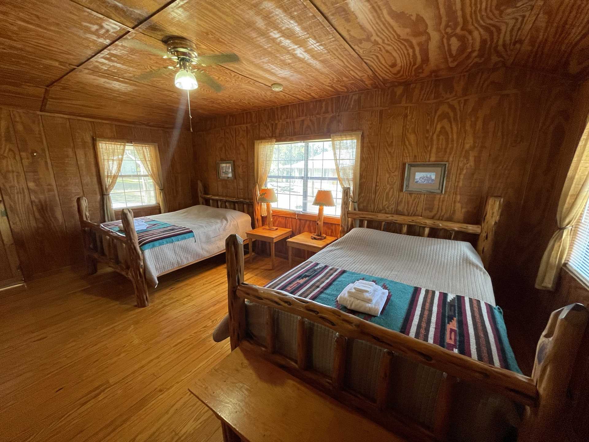                                                 Two queen-sized beds round out the comfy sleeping arrangements here, with room for up to five of your folks. Soft and clean linens are included, as well.