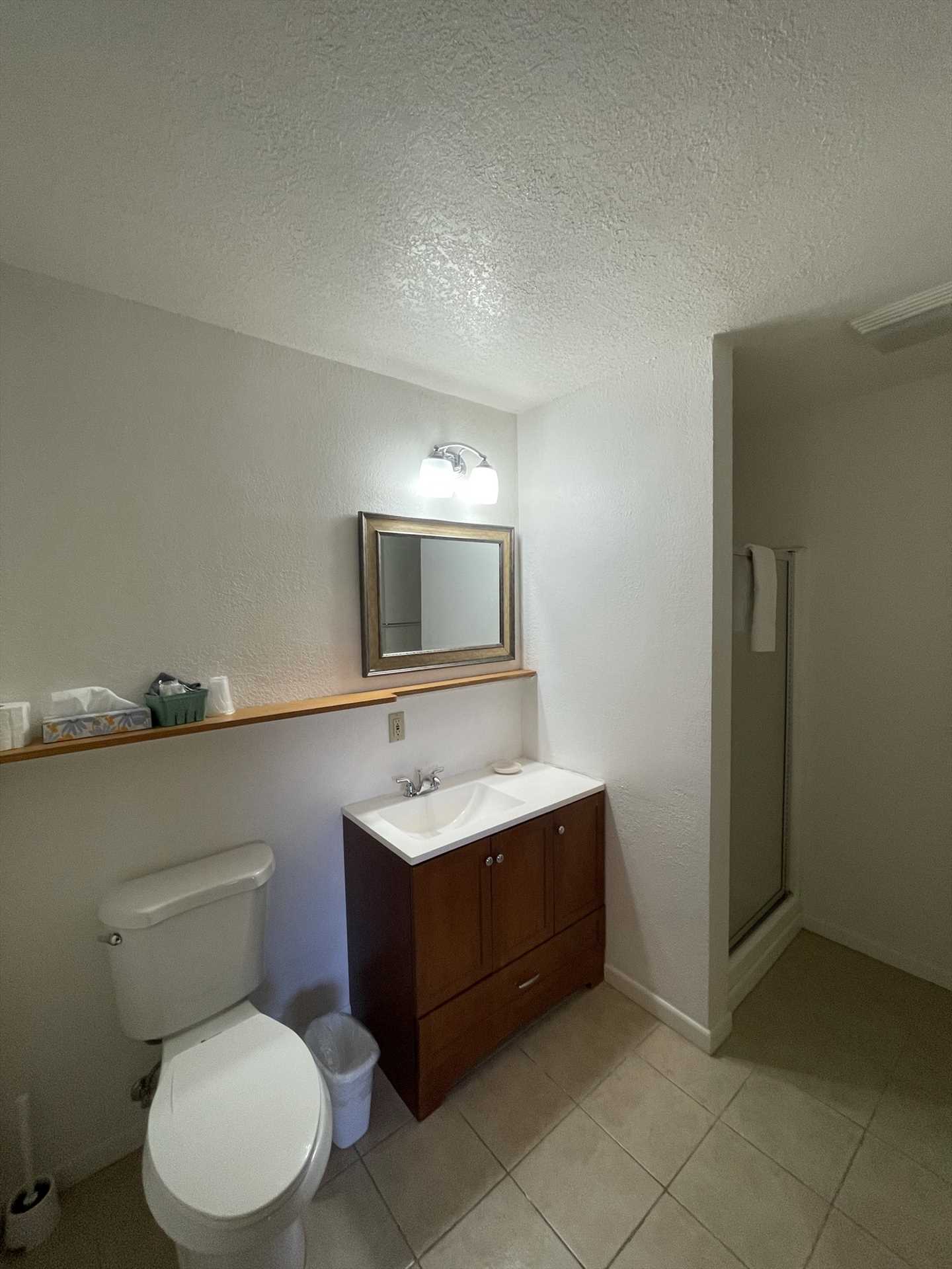                                                 Your spotless full bath features a shower stall, and all the fresh linens you'll need during your stay.