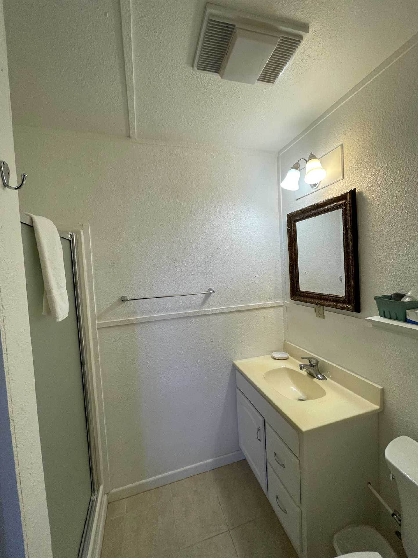                                                 A spotless shower stall and complimentary bath linens in the full bath make cleanup a snap!