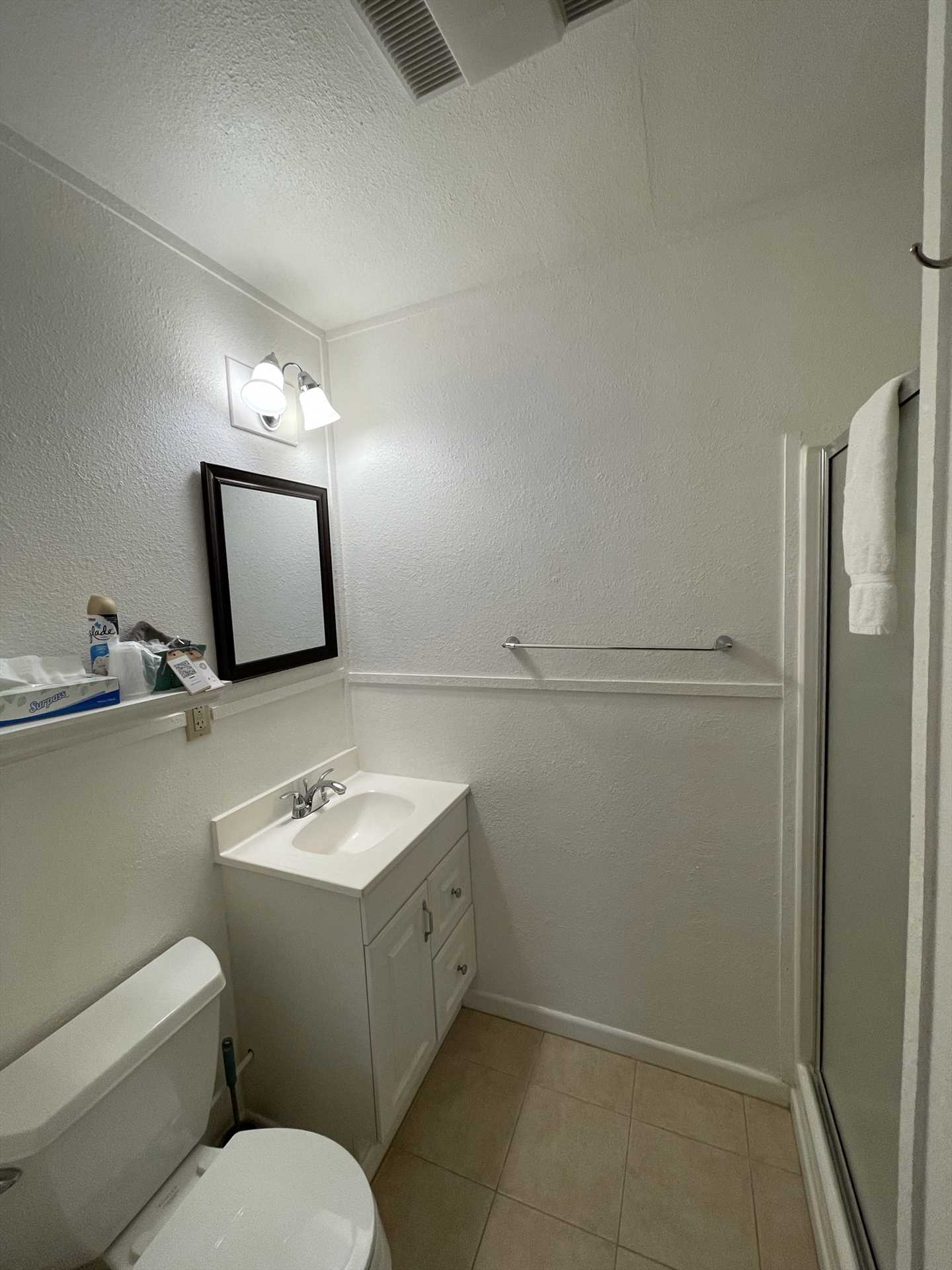                                                 Fresh linens are provided in the spotlessly-clean full bath, which includes a shower stall for cleanup ease.