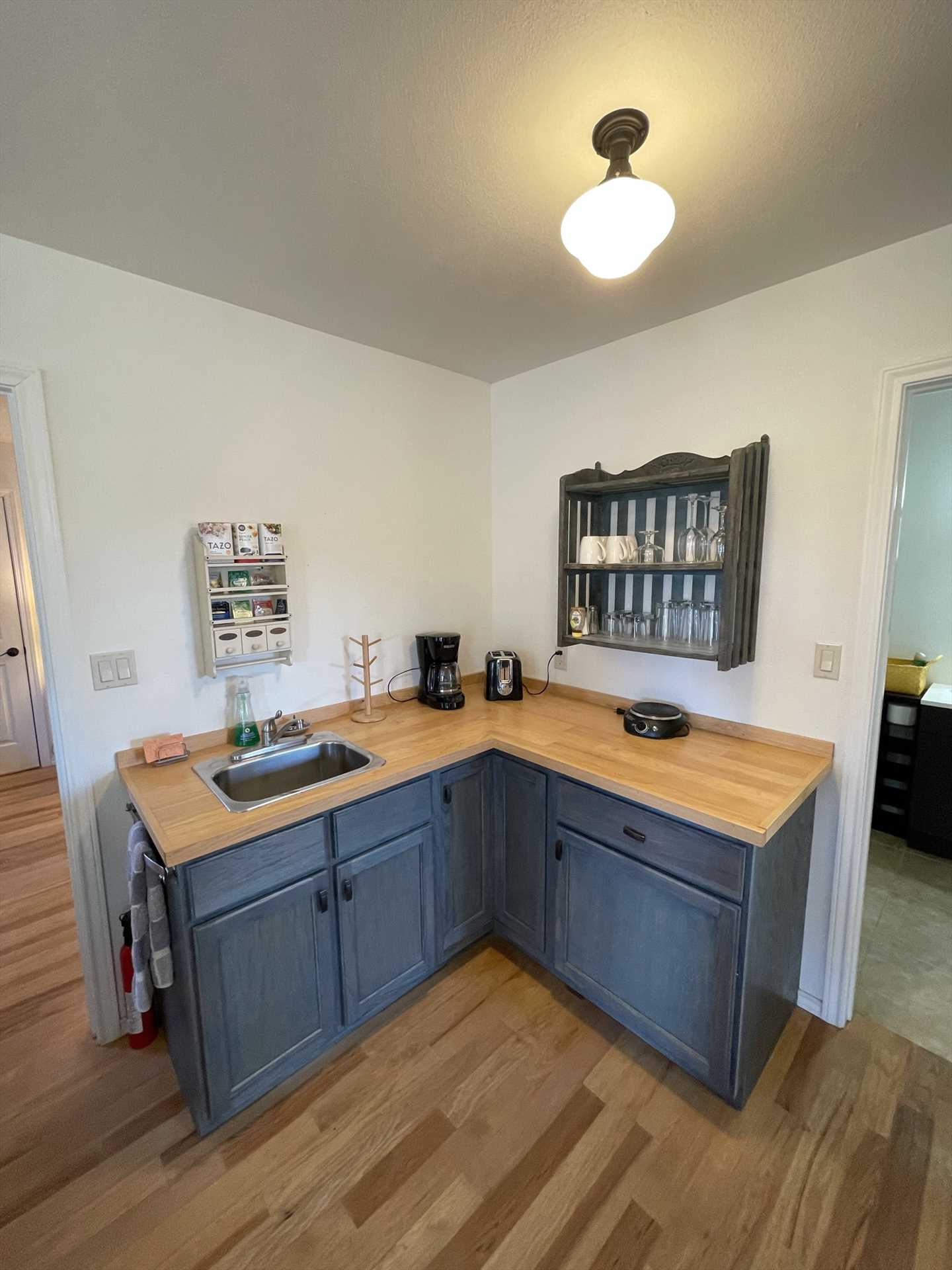                                                 Your cozy country kitchenette includes a mini fridge, sink, coffee maker, and toaster, as well as a charming dining area.