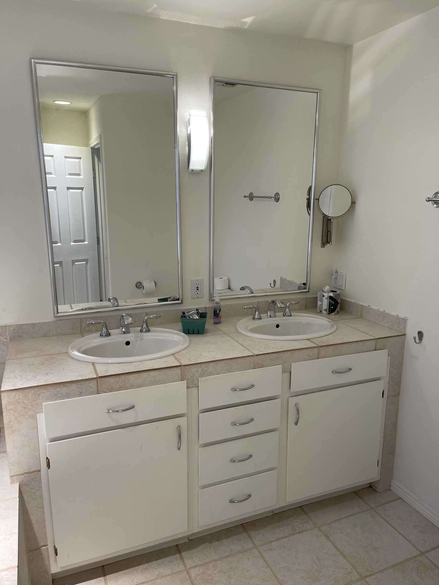                                                Twin vanities and plenty of clean bath linens make it easy to get ready for your exciting day!