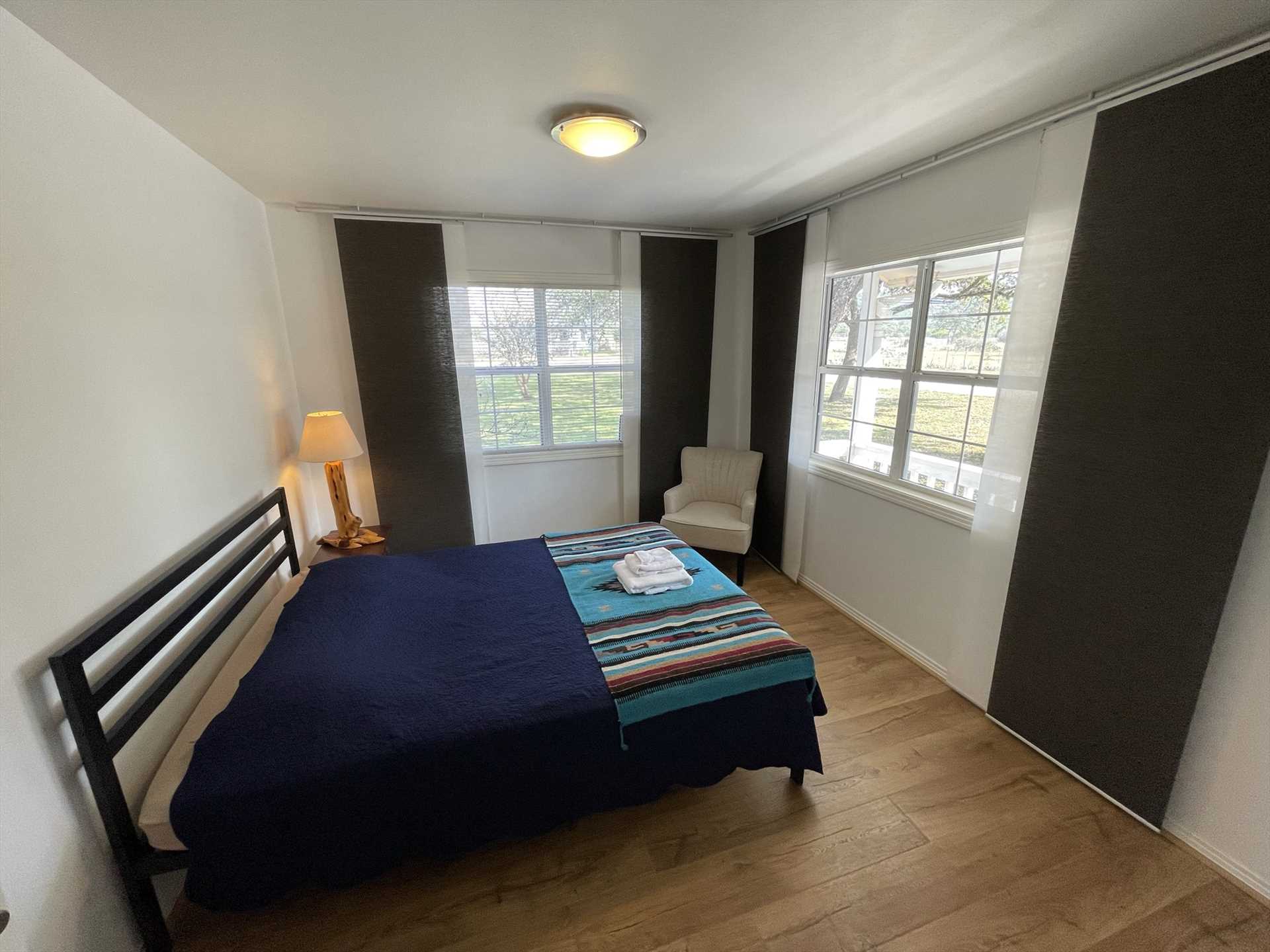                                                 Natural light awakens you in the morning in the second bedroom, complete with a queen-sized bed! Clean and soft bed linens are included, too.