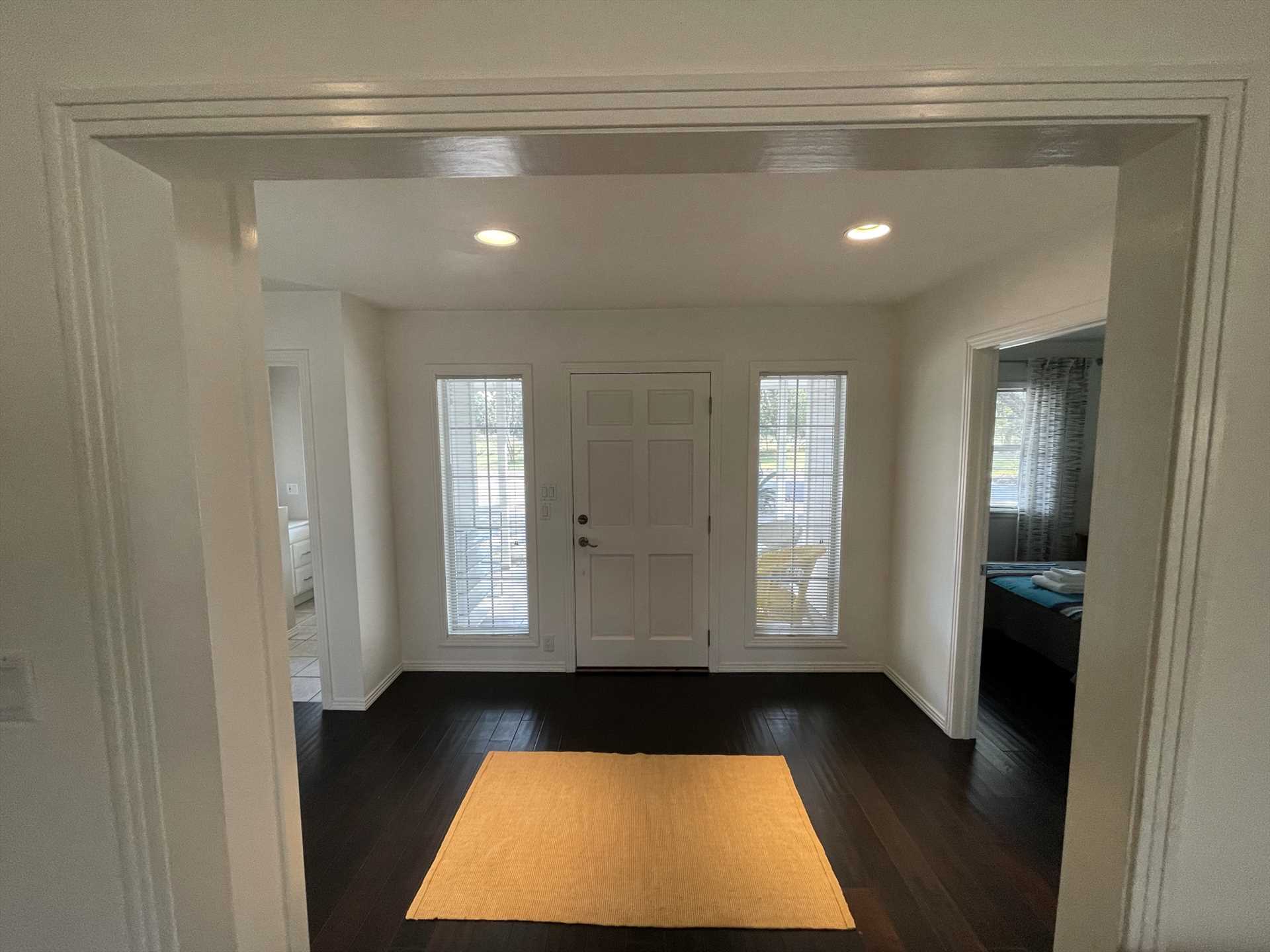                                                 Clean and elegant lines mark the entrance foyer in the Live Oak Cottage, offering a classy and warm welcome to the Hill Country!