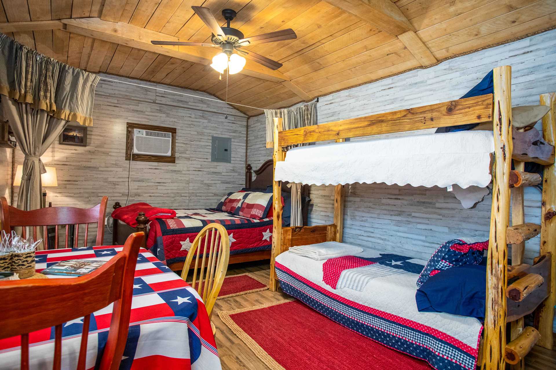                                                 A star-spangled queen-sized bed, and two twin bunks, provide restful sleep for up to four! All beds come with clean linens, too.