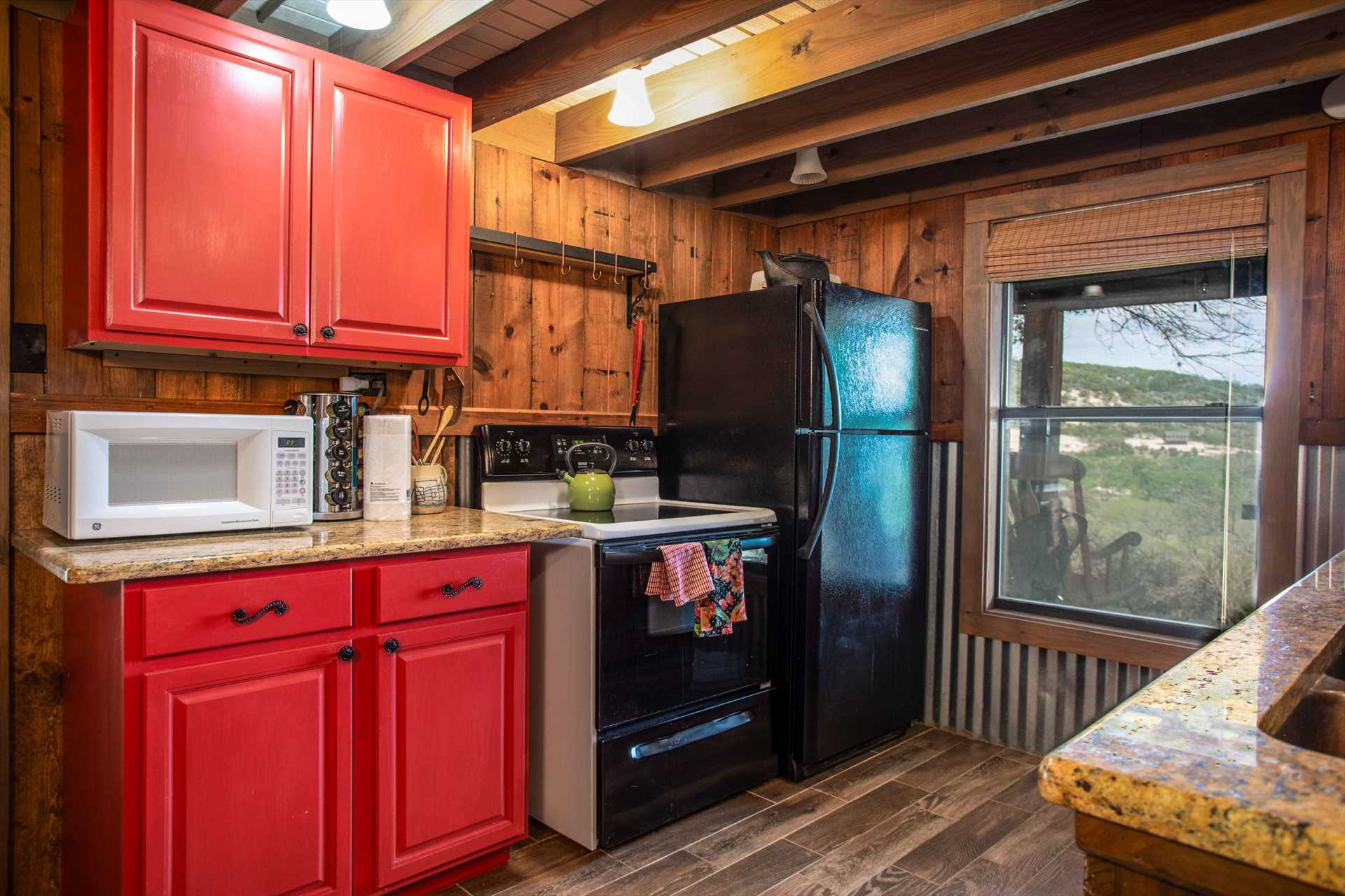                                                 Modern appliances add ease and function to the kitchen at Medina Mountain, not to mention that pretty Hill Country view!