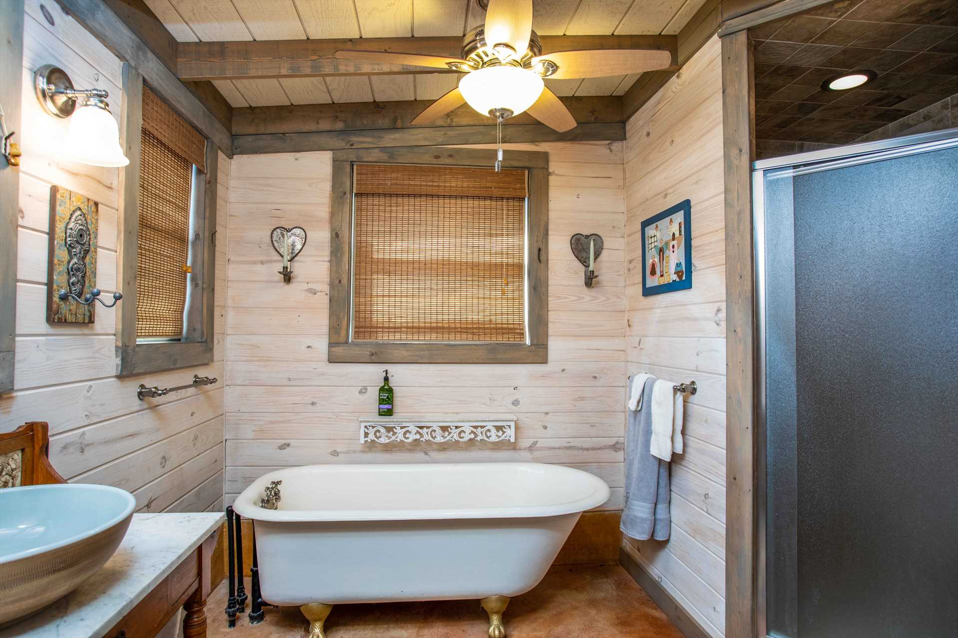                                                 Not only does the master bathroom have a roomy shower stall, but a nostalgic clawfoot tub, too, if you're in the mood for a deep and relaxing bath.
