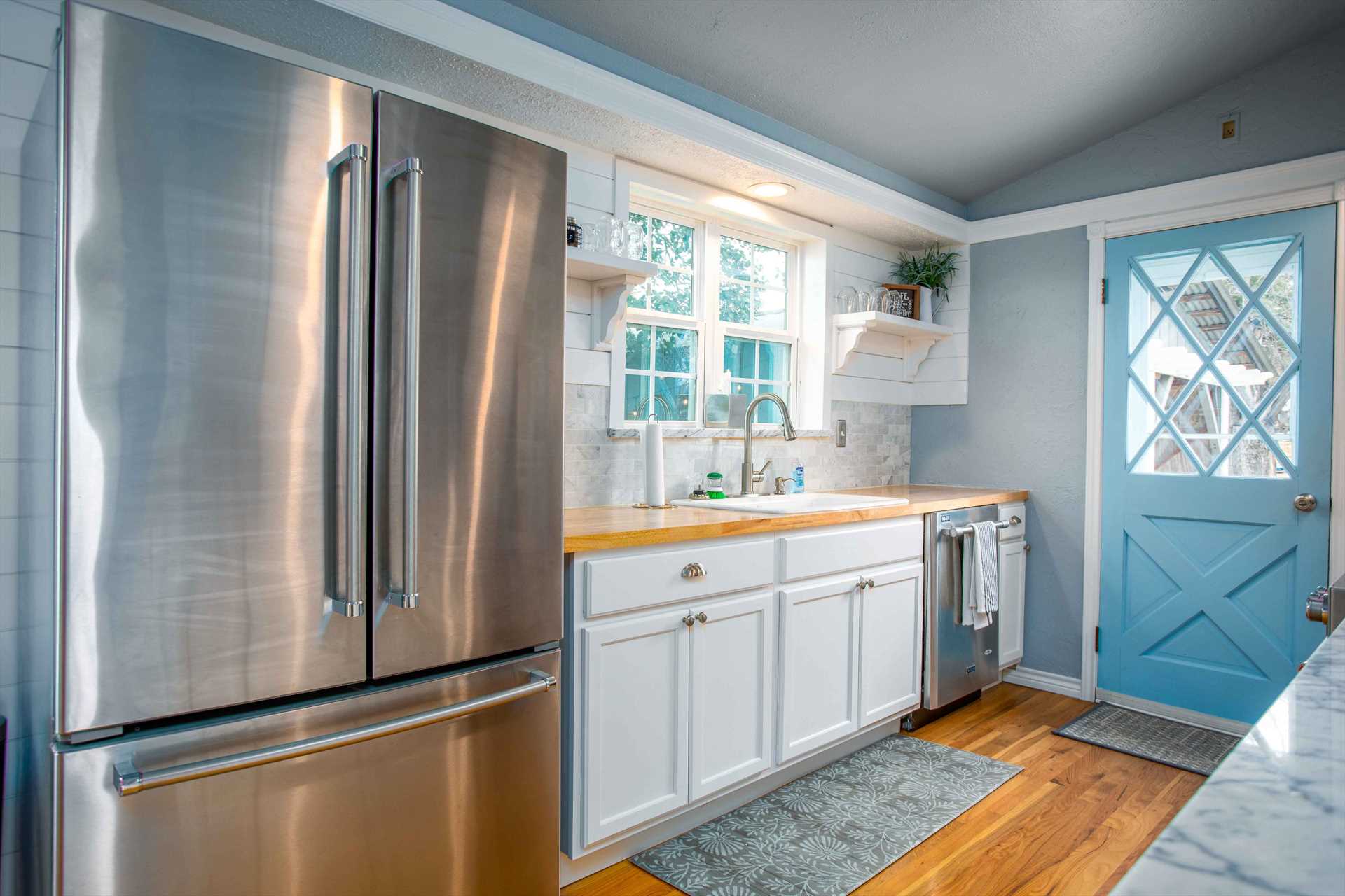                                                 The hardwood floors, color, and decor highlight the charms and comforts of a genuine country kitchen.