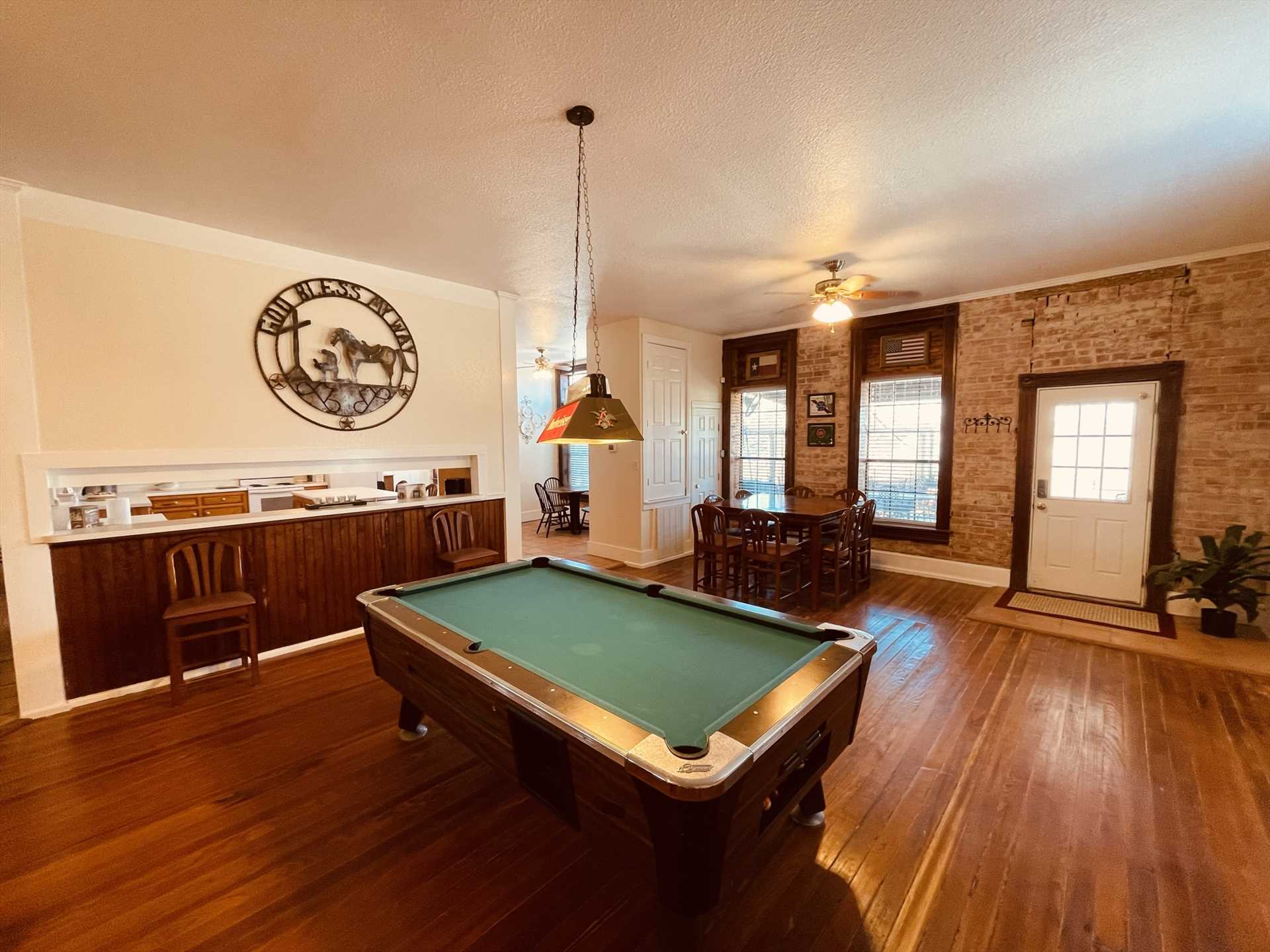                                                 Nearby bar seating provides a comfortable space to relax between shots while you enjoy the pool table.