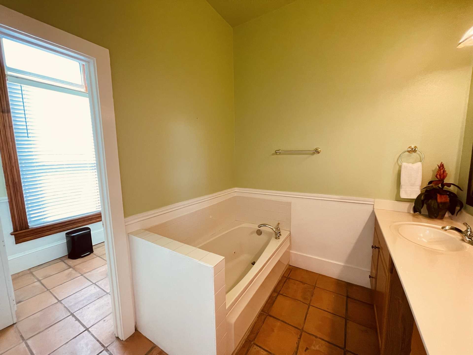                                                 While all the three bathrooms here include shower stalls, there's also a relaxing tub in the master bath!