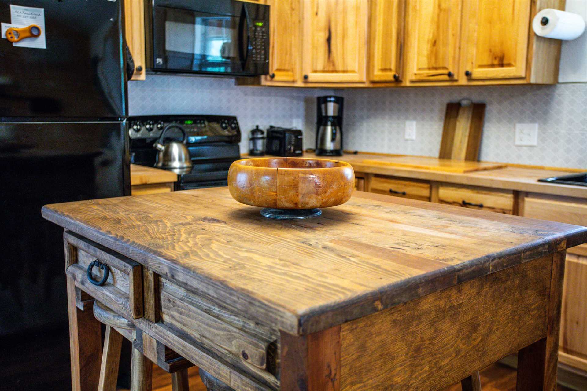                                                 Utility and nostalgia come together in the butcher block-style island in the country kitchen!