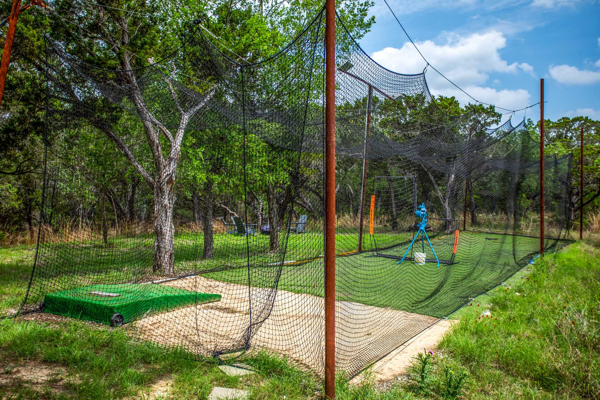                                                 The Retreat's batting cage has its own automatic pitching machine, and is netted for any hits that try to escape the park!