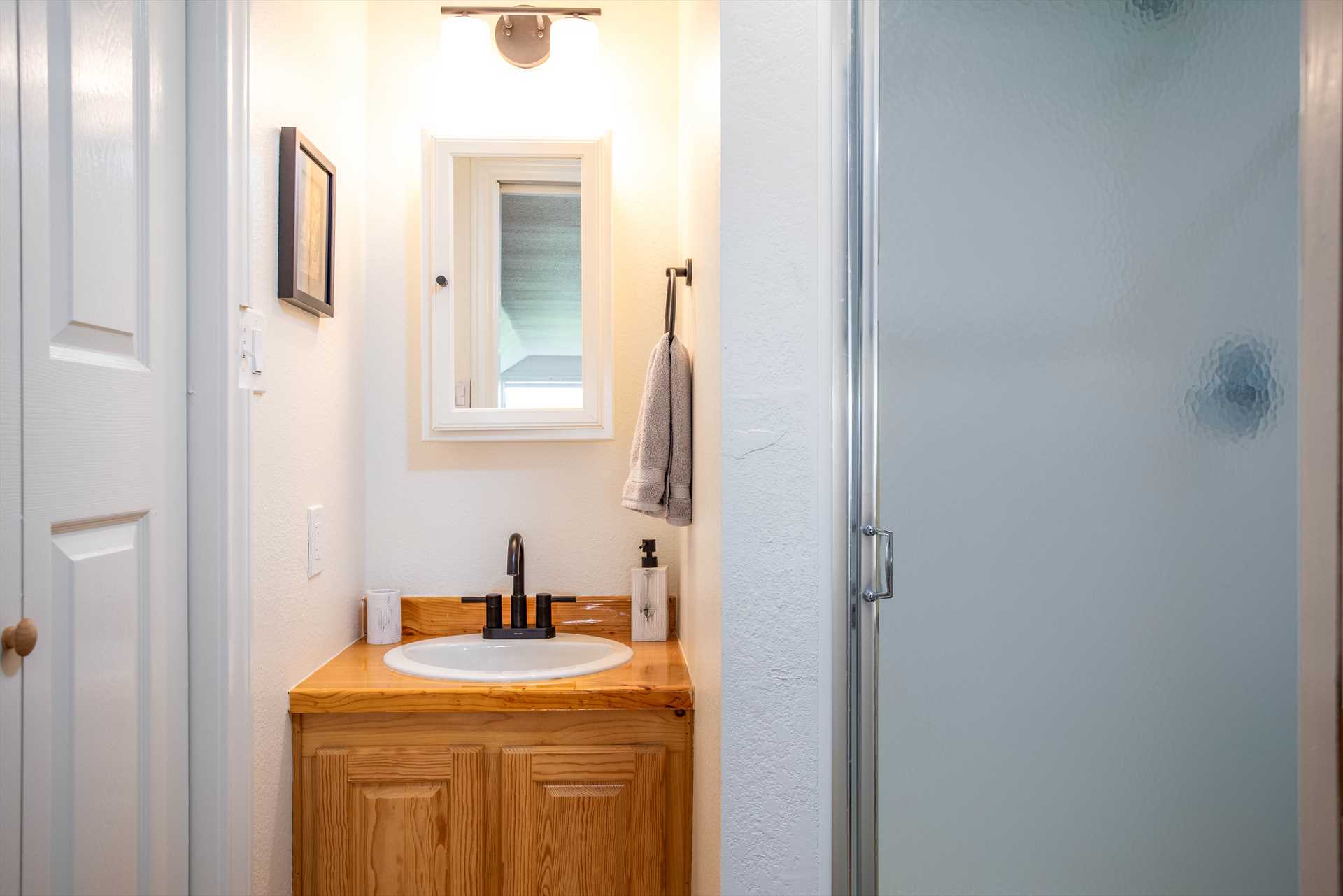                                                 The suite includes a full bath with a shower stall, and clean bath linens are also provided.