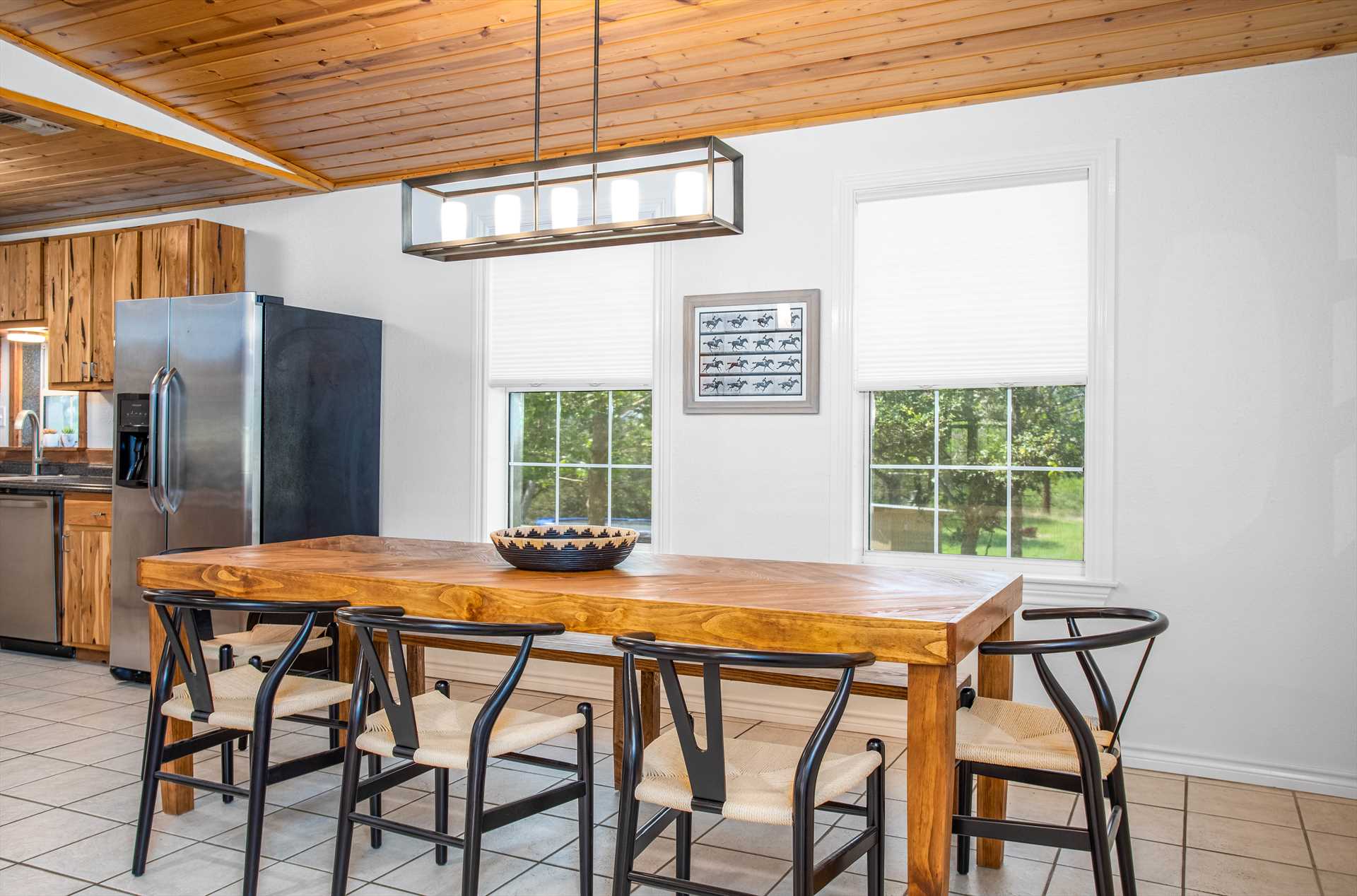                                                 The open layout of the kitchen and dining room helps keep the conversation going-no one misses a beat!