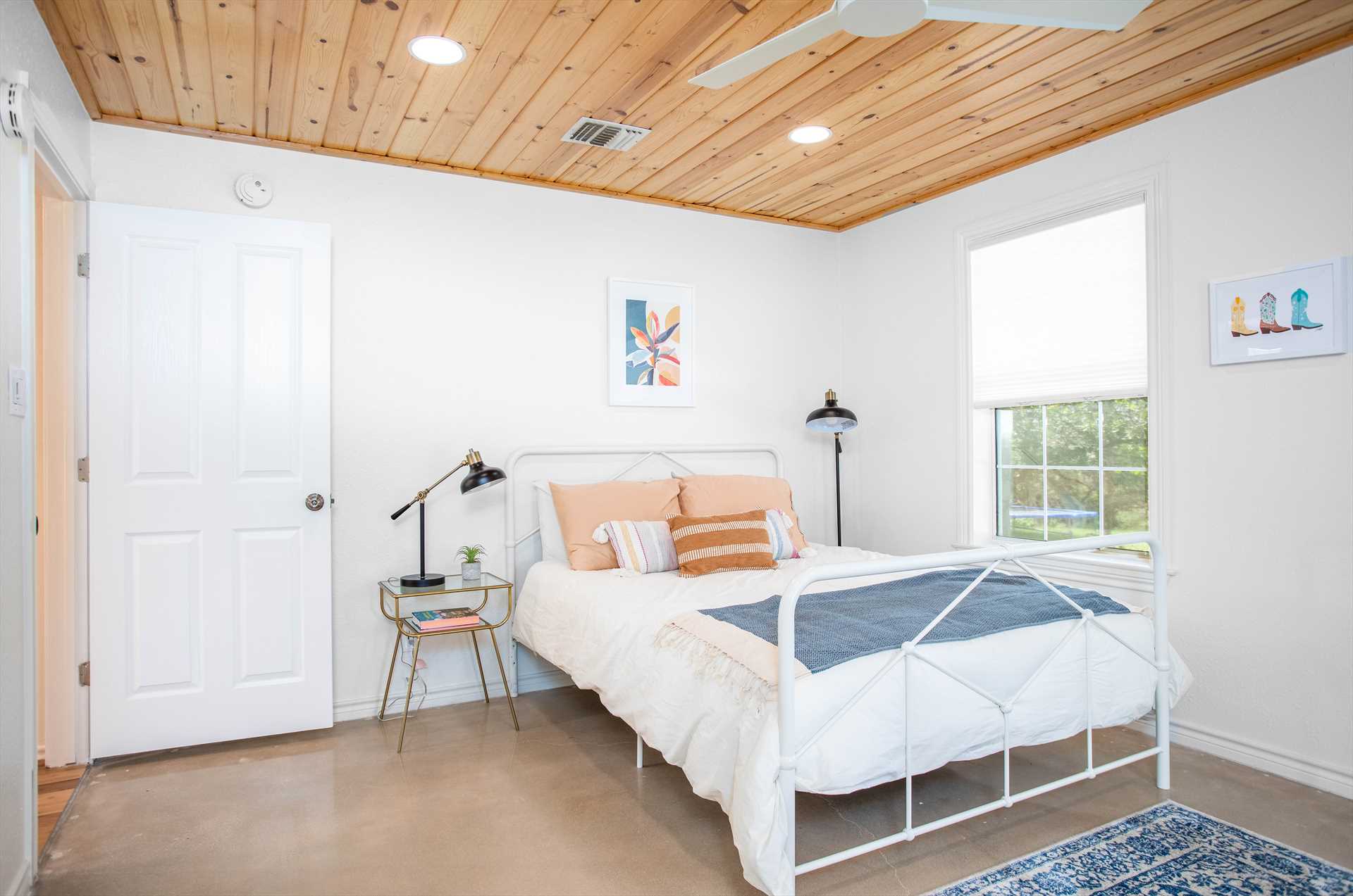                                                 A queen bed greets you in the airy and light second bedroom! All in all, the Retreat sleeps eight people (and up to 12 if you rent the optional suite).