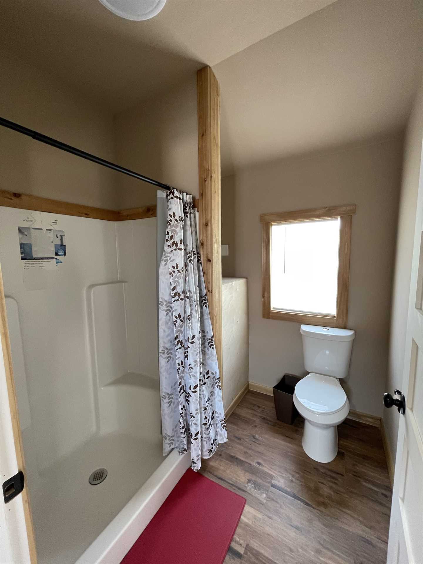                                                 Your spotless bathroom includes a big shower stall, and clean bath linens are provided, too!