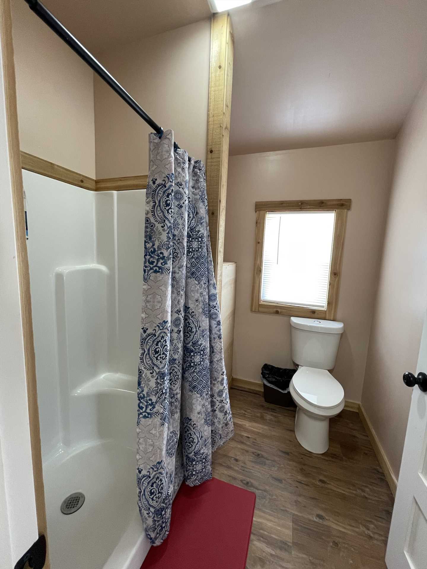                                                 The full bath here includes a roomy shower, and cleanup is made easy with complimentary bath linens, too!