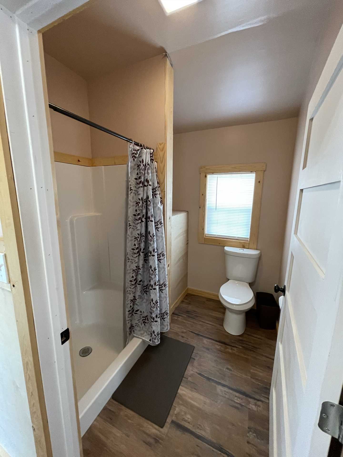                                                 You'll find a roomy shower stall and fresh bath linens in the cabin's sparkling-clean bathroom.