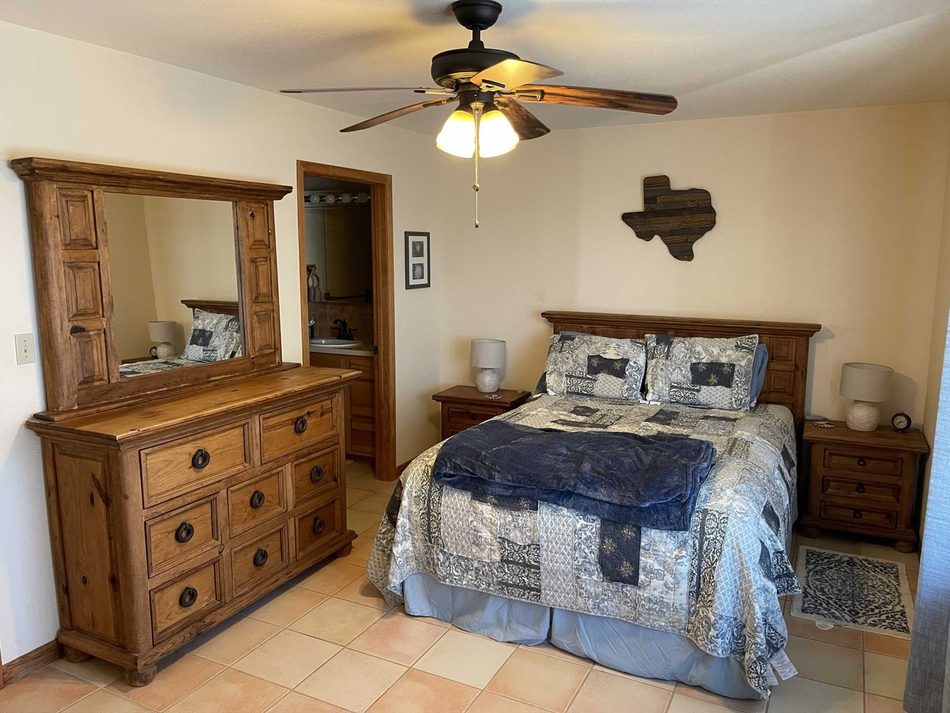                                                 The master bedroom has a comfy queen bed and its own adjoining full bath! All bed and bath linens at the cabin are provided for your stay, too.