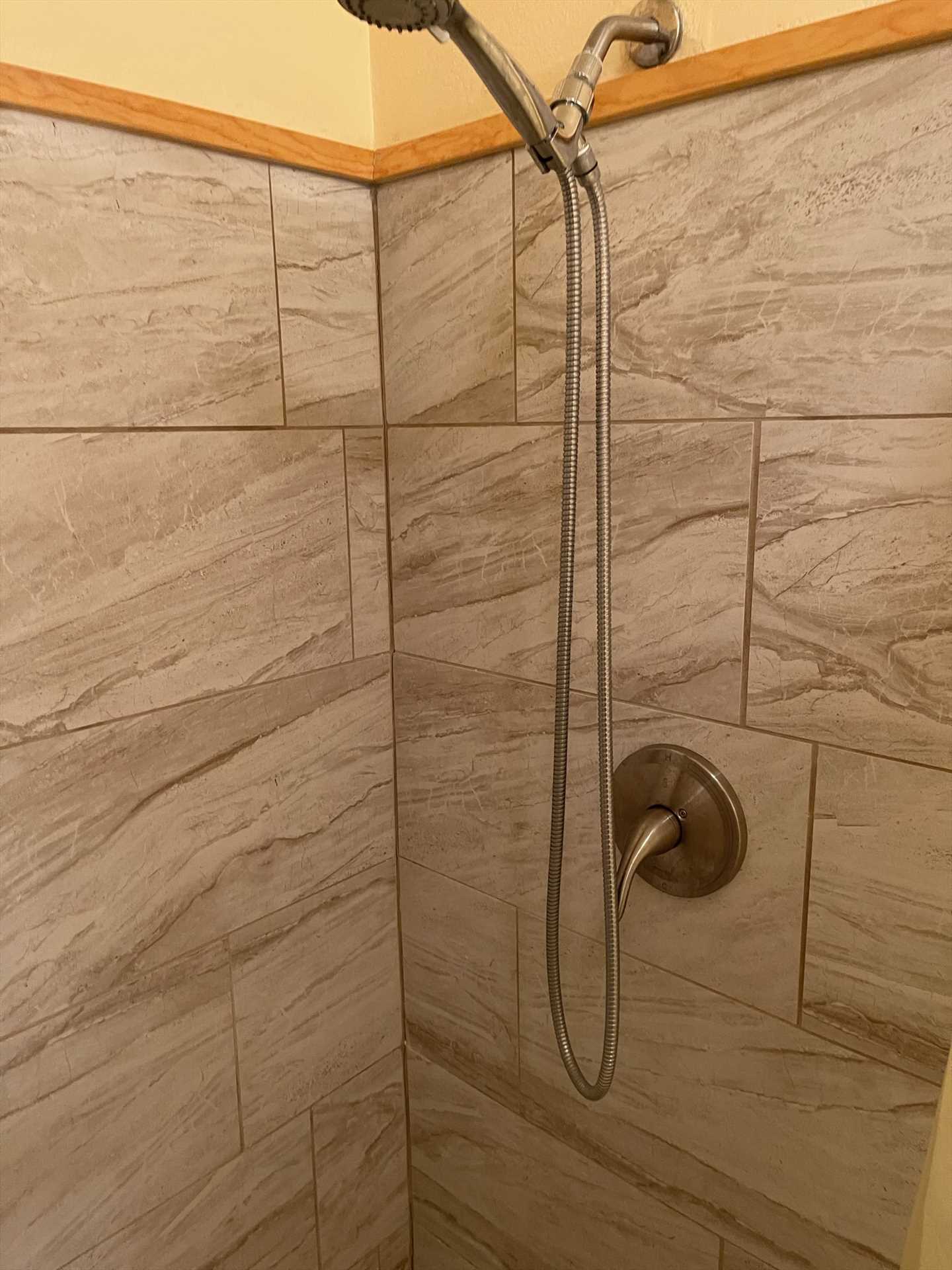                                                 A classy space for cleanup! This is the shower stall in the master bath.