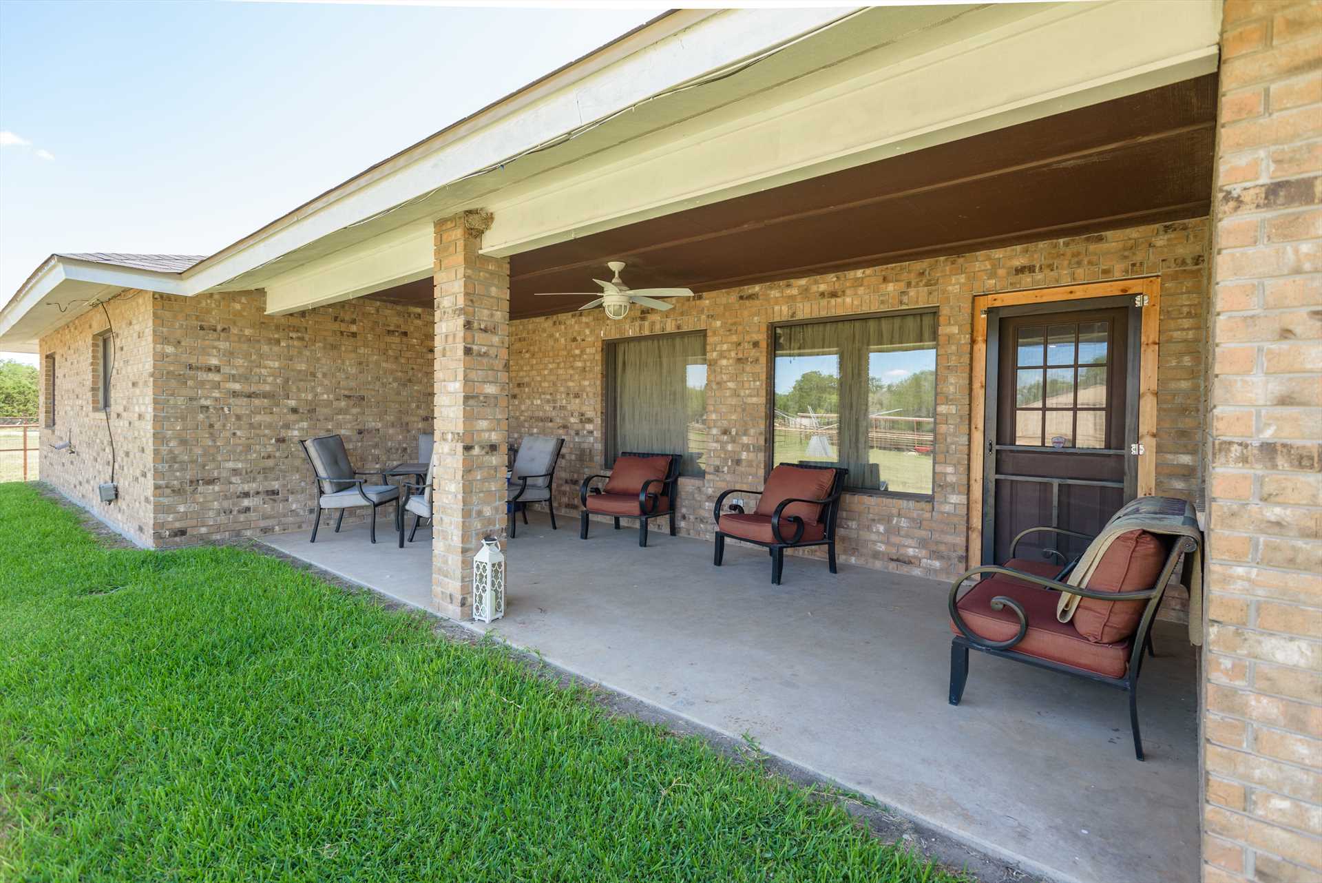                                                 Soft and comfy furniture on the shaded patio make it a great place to relax, chat, and take in the beautiful views!