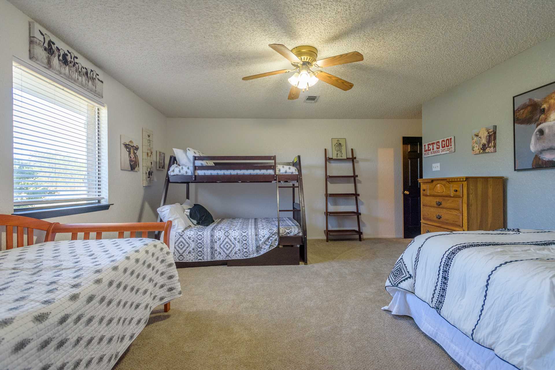                                                 Up to five people can sleep in warm comfort in the ranch's third bedroom, with two full-sized and three single beds! All bedding here comes with clean linens, too.